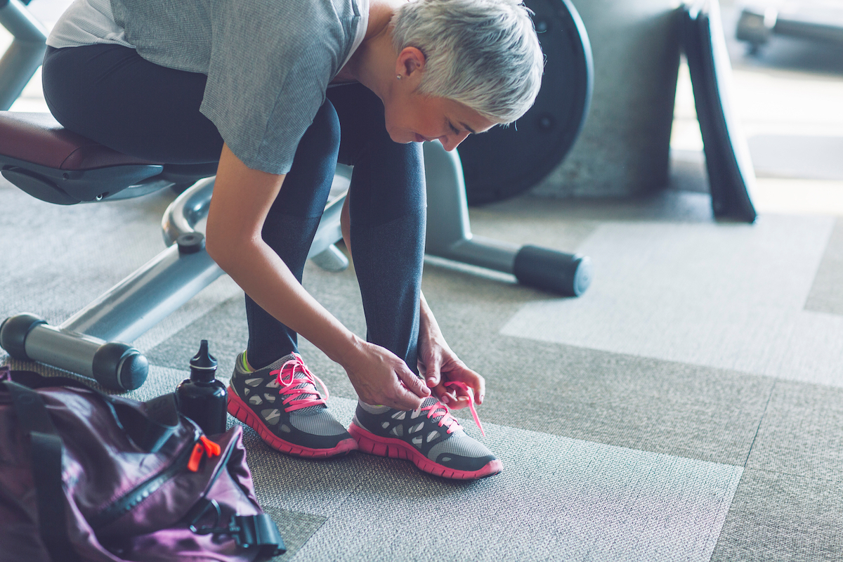 woman tying shoes